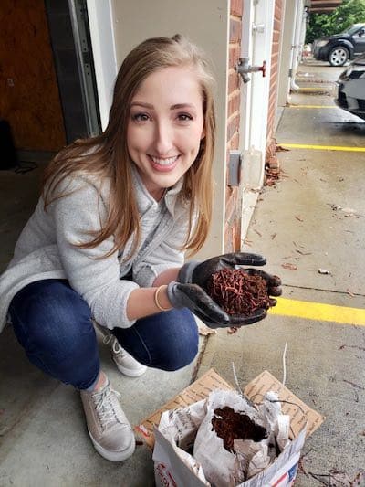 Urban Worm Bag Customer with Worms in her hands